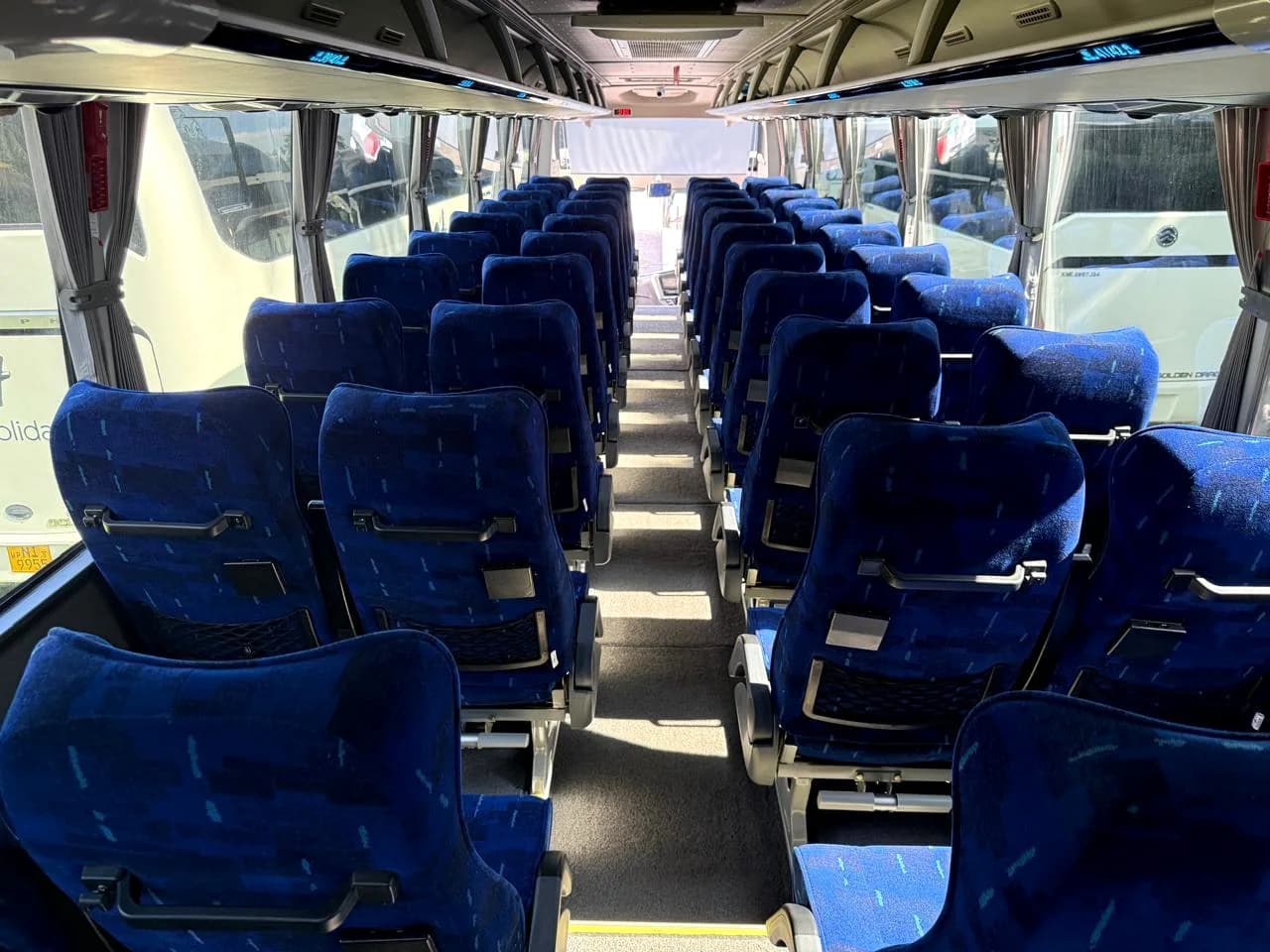 Air-conditioned coach interior with passenger seating