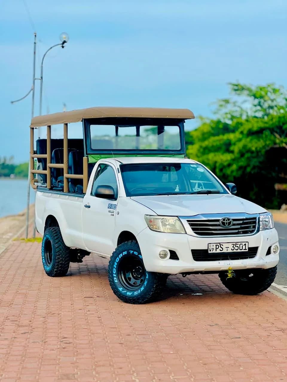 Open-sided safari vehicle category used for wildlife experiences