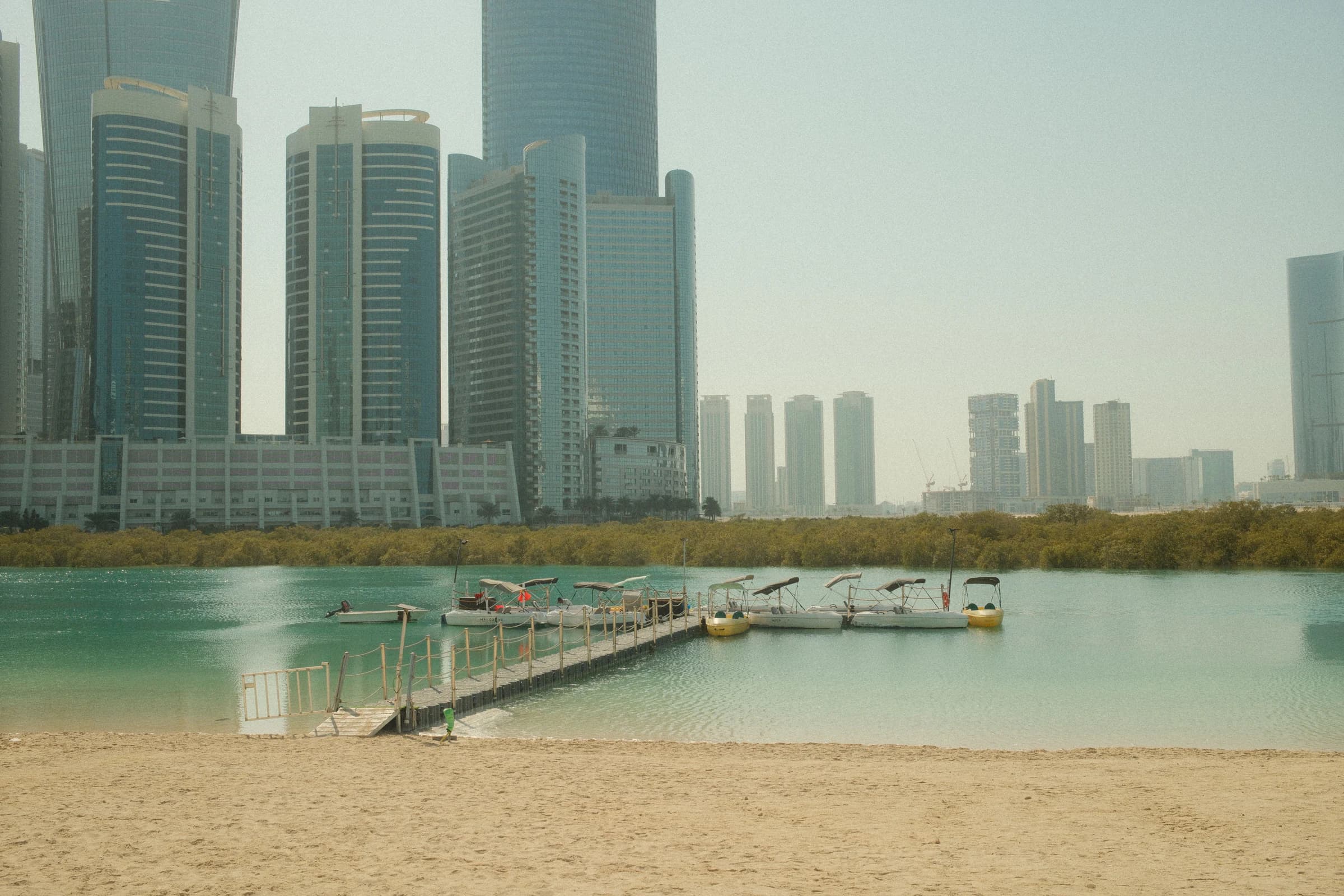 Abu Dhabi waterfront skyline beneath a clear sky