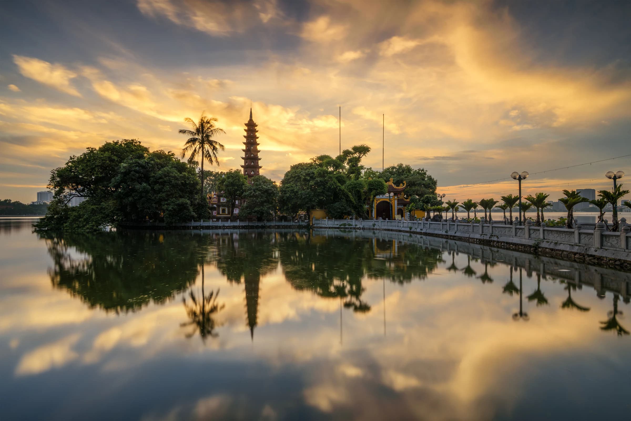 Tran Quoc Pagoda beside Hanoi’s West Lake at sunset